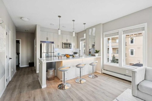 306-20 Mahogany Mews Se, Calgary, AB - Indoor Photo Showing Kitchen With Stainless Steel Kitchen With Upgraded Kitchen