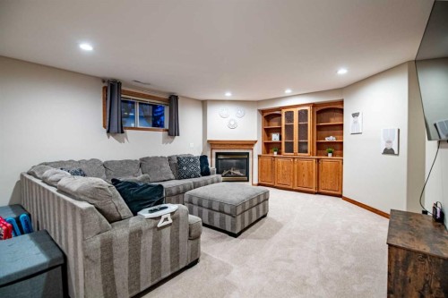 114 Alberts Close, Red Deer, AB - Indoor Photo Showing Basement With Fireplace