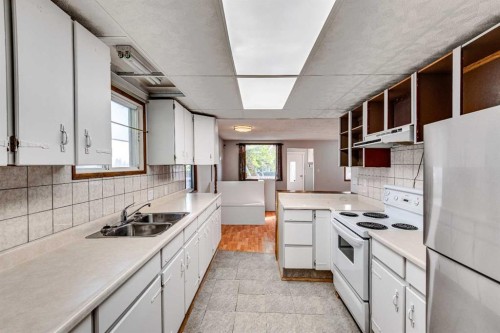 402 Main Street, Trochu, AB - Indoor Photo Showing Kitchen With Double Sink