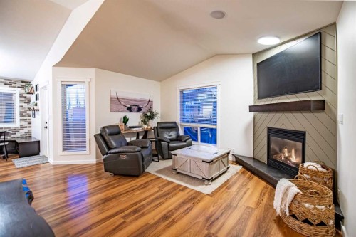 42 Landry Bend, Red Deer, AB - Indoor Photo Showing Living Room With Fireplace