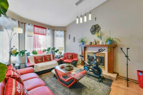 56 Dawson Street, Red Deer, AB - Indoor Photo Showing Living Room With Fireplace