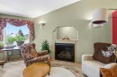 109 Kingston Drive, Red Deer, AB  - Indoor Photo Showing Living Room With Fireplace 