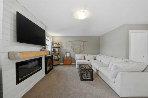 35 Tory Close, Red Deer, AB - Indoor Photo Showing Living Room With Fireplace