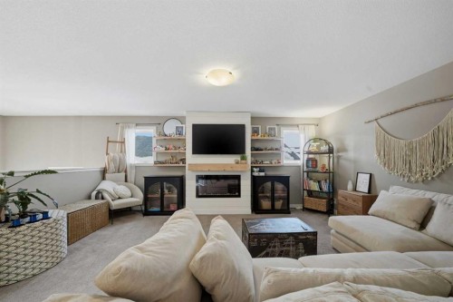 35 Tory Close, Red Deer, AB - Indoor Photo Showing Living Room With Fireplace