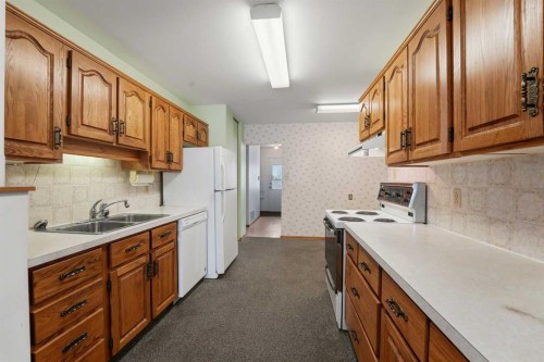 3927 Exeter Crescent, Red Deer, AB - Indoor Photo Showing Kitchen With Double Sink