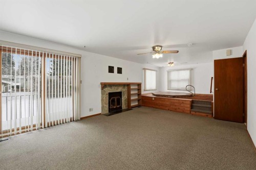 3927 Exeter Crescent, Red Deer, AB - Indoor With Fireplace