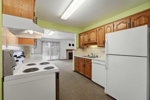 3927 Exeter Crescent, Red Deer, AB - Indoor Photo Showing Kitchen With Double Sink