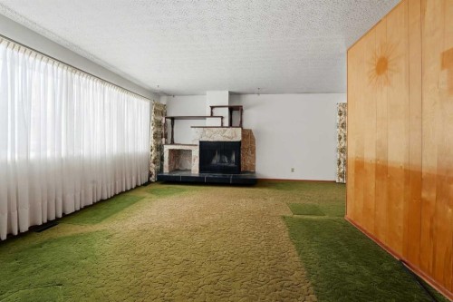 3927 Exeter Crescent, Red Deer, AB - Indoor Photo Showing Living Room With Fireplace