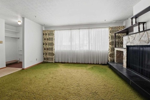 3927 Exeter Crescent, Red Deer, AB - Indoor Photo Showing Other Room With Fireplace