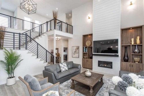 2 Twin Rose Court, Jarvis Bay, AB - Indoor Photo Showing Living Room With Fireplace