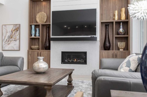 2 Twin Rose Court, Jarvis Bay, AB - Indoor Photo Showing Living Room With Fireplace