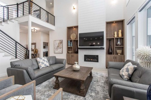 2 Twin Rose Court, Jarvis Bay, AB - Indoor Photo Showing Living Room With Fireplace