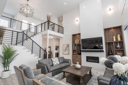 2 Twin Rose Court, Jarvis Bay, AB - Indoor Photo Showing Living Room With Fireplace