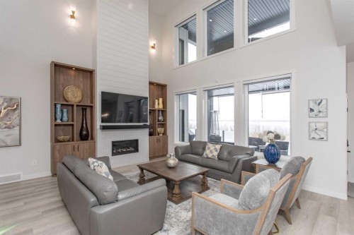 2 Twin Rose Court, Jarvis Bay, AB - Indoor Photo Showing Living Room With Fireplace