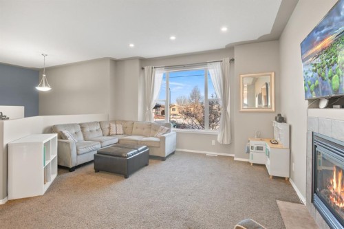 23 Jepsen Crescent, Red Deer, AB - Indoor Photo Showing Living Room With Fireplace