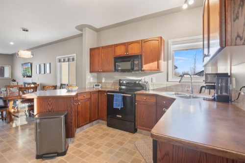 23 Jepsen Crescent, Red Deer, AB - Indoor Photo Showing Kitchen With Double Sink