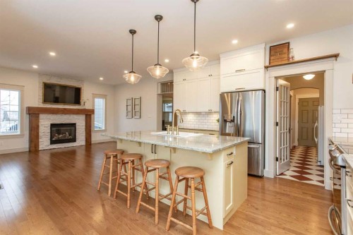 32 Carter Close, Red Deer, AB - Indoor Photo Showing Kitchen With Fireplace With Upgraded Kitchen