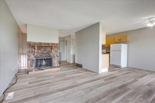5210 61 Avenue, Olds, AB - Indoor Photo Showing Living Room With Fireplace