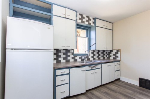 4206 51A Street, Red Deer, AB - Indoor Photo Showing Kitchen With Double Sink