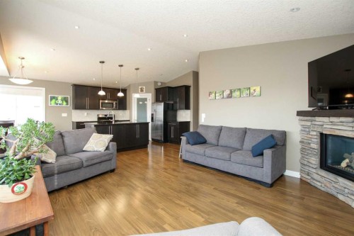 5825 Panorama Drive, Blackfalds, AB - Indoor Photo Showing Living Room With Fireplace
