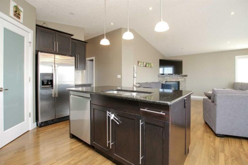 5825 Panorama Drive, Blackfalds, AB - Indoor Photo Showing Kitchen With Fireplace With Upgraded Kitchen