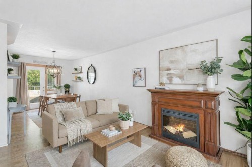 5436 53 Avenue, Lacombe, AB - Indoor Photo Showing Living Room With Fireplace