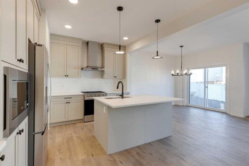 1419 Bayview Crescent Sw, Airdrie, AB - Indoor Photo Showing Kitchen With Upgraded Kitchen