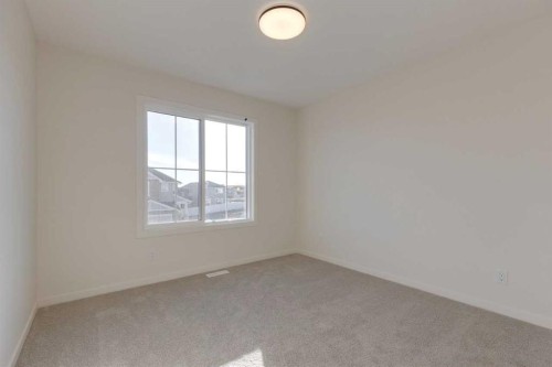 1419 Bayview Crescent Sw, Airdrie, AB - Indoor Photo Showing Other Room