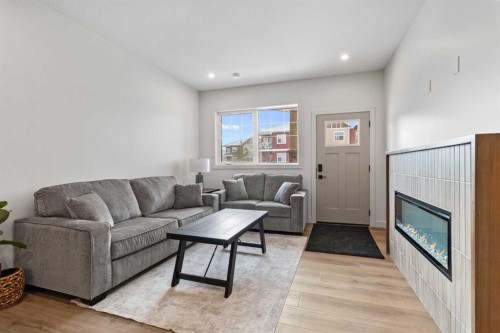 4940 Beardsley Avenue, Lacombe, AB - Indoor Photo Showing Living Room With Fireplace