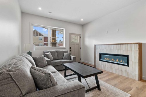 4940 Beardsley Avenue, Lacombe, AB - Indoor Photo Showing Living Room With Fireplace