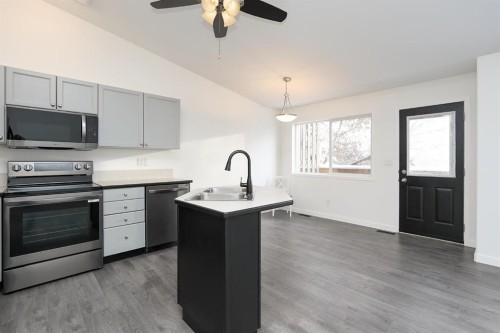 65 Leung Place, Blackfalds, AB - Indoor Photo Showing Kitchen With Double Sink