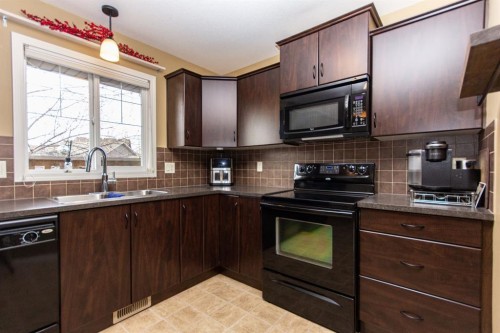 114 Redwood Boulevard, Springbrook, AB - Indoor Photo Showing Kitchen With Double Sink