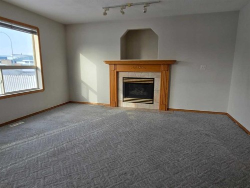 30 Logan Close, Red Deer, AB - Indoor Photo Showing Other Room With Fireplace