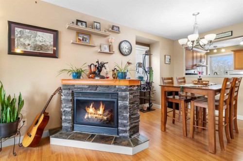 1231 21 Street, Bowden, AB - Indoor Photo Showing Dining Room With Fireplace