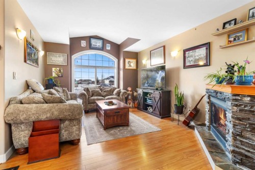 1231 21 Street, Bowden, AB - Indoor Photo Showing Living Room With Fireplace