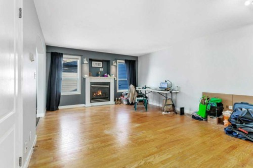 132 Sabre Road, Springbrook, AB - Indoor Photo Showing Living Room With Fireplace