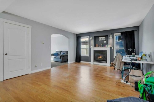 132 Sabre Road, Springbrook, AB - Indoor Photo Showing Living Room With Fireplace