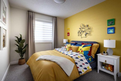 566 Wolf Willow Boulevard Se, Calgary, AB - Indoor Photo Showing Bedroom