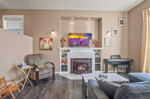 10 Timmons Close, Lacombe, AB - Indoor Photo Showing Living Room With Fireplace