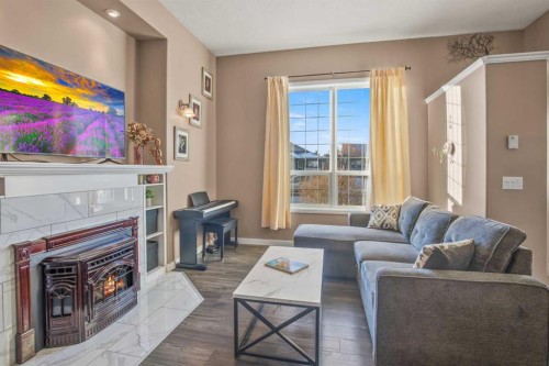 10 Timmons Close, Lacombe, AB - Indoor Photo Showing Living Room With Fireplace