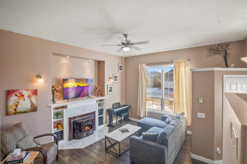 10 Timmons Close, Lacombe, AB - Indoor Photo Showing Living Room With Fireplace