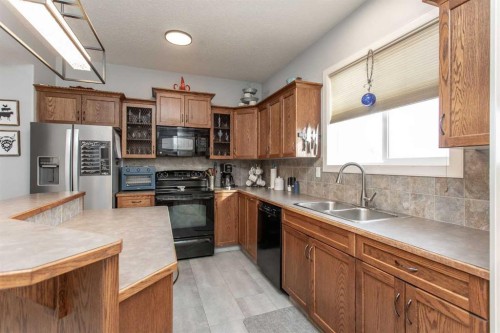 156 Long Close, Red Deer, AB - Indoor Photo Showing Kitchen With Double Sink