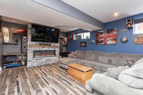 156 Long Close, Red Deer, AB - Indoor Photo Showing Living Room With Fireplace