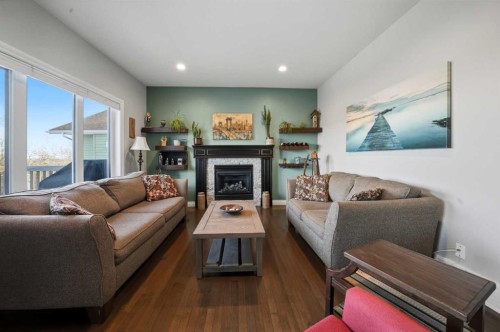 25 Cole Way, Sylvan Lake, AB - Indoor Photo Showing Living Room With Fireplace