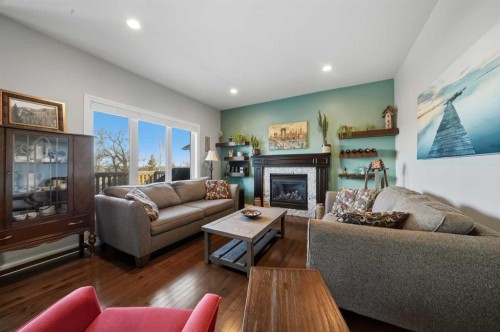 25 Cole Way, Sylvan Lake, AB - Indoor Photo Showing Living Room With Fireplace