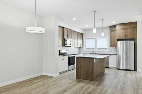 309 Cobblestone Gate Sw, Airdrie, AB - Indoor Photo Showing Kitchen With Upgraded Kitchen