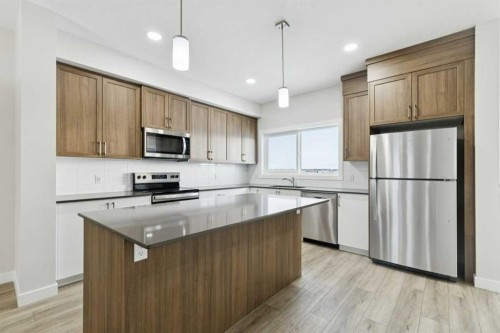 309 Cobblestone Gate Sw, Airdrie, AB - Indoor Photo Showing Kitchen With Upgraded Kitchen