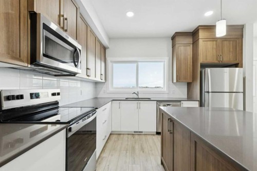 309 Cobblestone Gate Sw, Airdrie, AB - Indoor Photo Showing Kitchen With Upgraded Kitchen