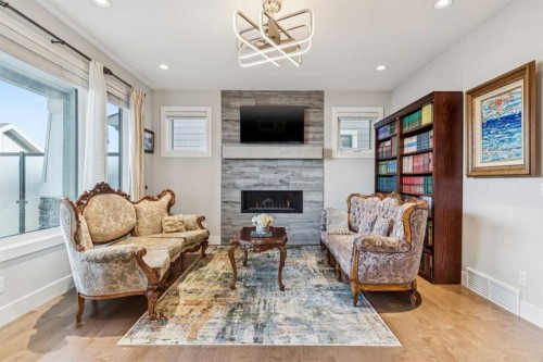 38 Yarrow Gate, Rural Rocky View County, AB - Indoor Photo Showing Living Room With Fireplace