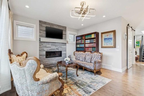 38 Yarrow Gate, Rural Rocky View County, AB - Indoor Photo Showing Living Room With Fireplace